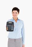 Businesswoman showing a calculator