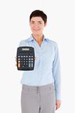 Female office worker showing a calculator