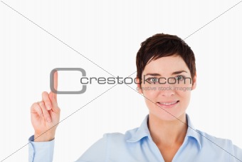 Close up of a woman pointing at copy space