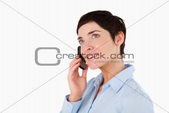 Close up of a serious woman making a phone call