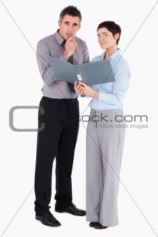 Office workers holding a binder