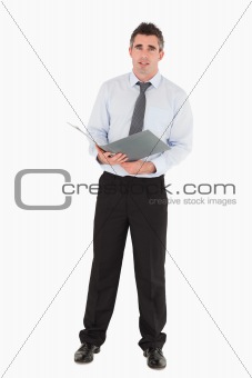 Businessman holding a binder