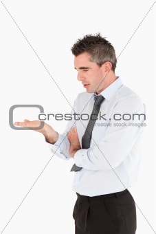Portrait of a businessman looking a copy space on his hand