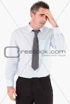 Portrait of a sad businessman with his hand on his forehead