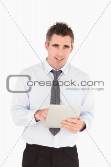 Portrait of a businessman with a tablet computer