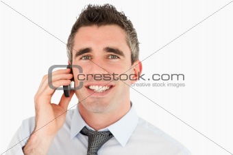 Close up of a happy businessman making a phone call