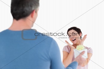 Brunette woman touched by her husband's present