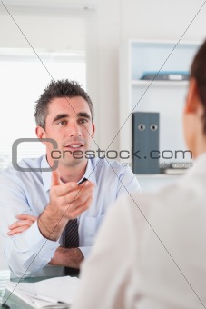 Portrait of a manager talking to a candidate