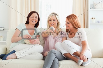 Young Women watching a movie eating popcorn