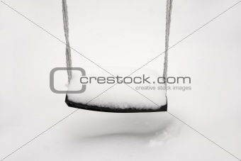 Empty swing in winter
