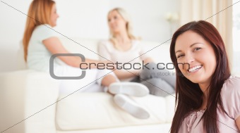 Charming Women chatting on a sofa