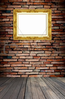 golden frame on old brick wall