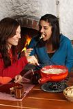 Women eating fondue