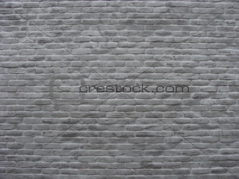 brick wall painted in soft tints of gray                        