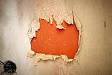orange wallpaper hole