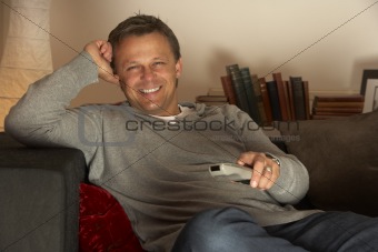 Man Relaxing With Remote Control