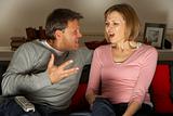 Couple Discussing Choice Of Television Channel