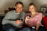 Couple Drinking Wine And Watching Television