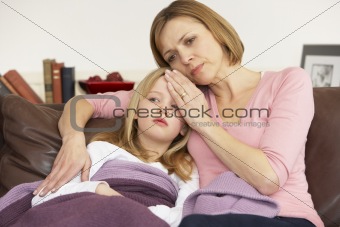 Mother Taking Temperature Of Sick Daughter