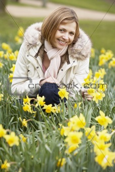 Woman Kneeling In Daffodils
