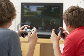 Two Boys Playing With Game Console