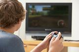 Teenage Boy Playing With Game Console