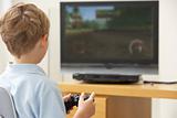 Young Boy Playing With Game Console