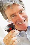 Man Drinking A Glass Of Red Wine