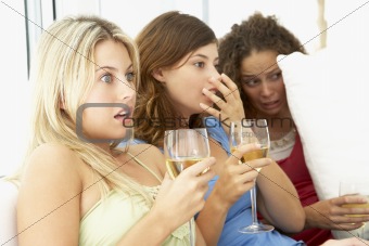 Female Friends Watching A Scary Movie Together
