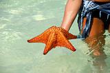 Woman and red starfish