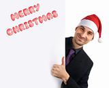 Christmas concept. Young man holding blank white card.