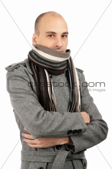 Portrait of handsome man in scarf and coat