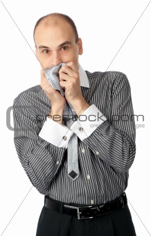 Worried business man holding his hands to mouth