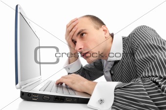 Worried businessman with computer