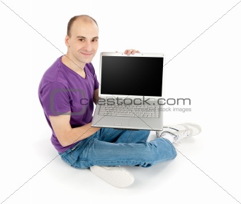 young man holding laptop computer with blank screen