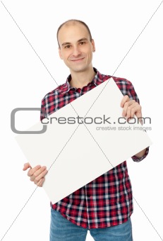 happy handsome young man holding blank white card