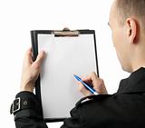 Businessman writing on a blank paper