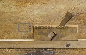 planer on wood in rusty background