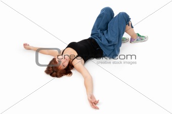 young girl lying on a white floor
