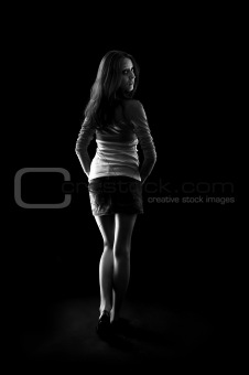 Young woman in the dark