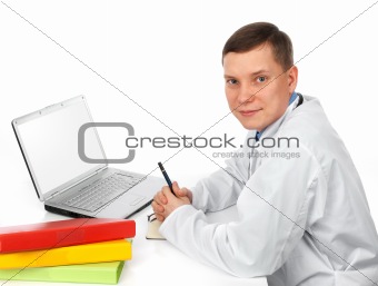 Handsome doctor using computer 