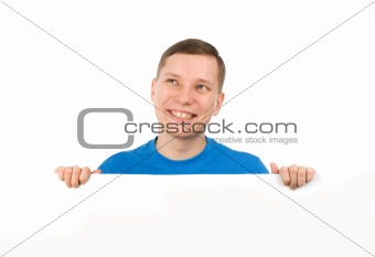 young man looking over a blank board