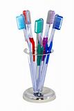 five toothbrushes in a metal holder