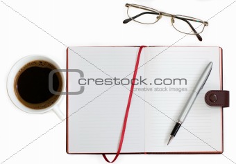 cup of coffee, notebook and glasses on white background