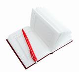 Empty open diary and red ball point pen