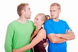 man with a girlfriend sticking out tongue to his jealaus brother - isolated on white