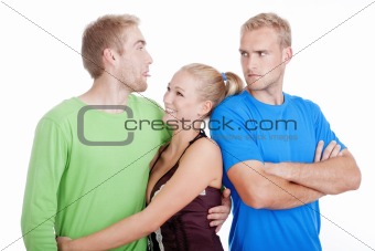 man with a girlfriend sticking out tongue to his jealaus brother - isolated on white