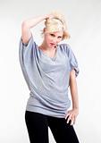 sexy blond girl in oversized gray shirt looking- isolated on white