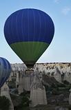 Green Blue hot air balloon low level flight