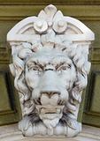 antique sculpture of the head of a lion